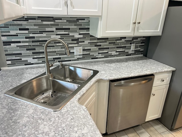6563 Parkview Cir, Baxter, MN 56425 - kitchen with appliances with stainless steel finishes, a sink, backsplash, and white cabinets