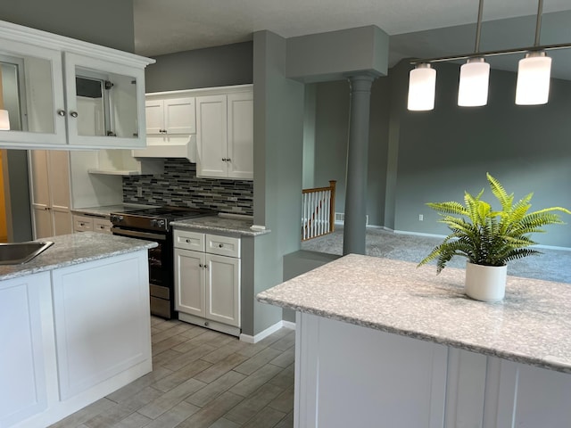 6563 Parkview Cir, Baxter, MN 56425 - kitchen featuring electric stove, white cabinets, under cabinet range hood, backsplash, and light wood-style floors