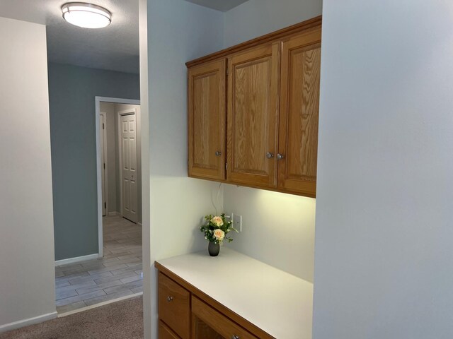 6563 Parkview Cir, Baxter, MN 56425 - hall featuring baseboards, light carpet, and light tile patterned floors