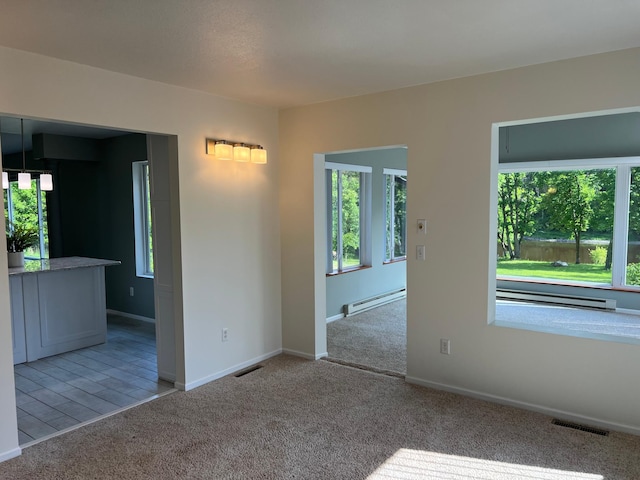 6563 Parkview Cir, Baxter, MN 56425 - carpeted spare room with a baseboard heating unit and baseboards