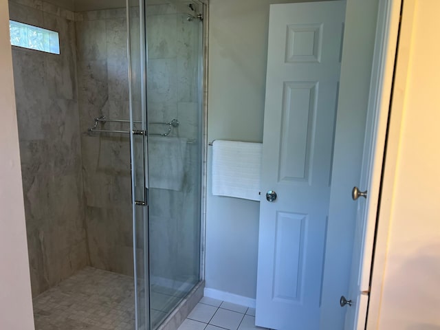 6563 Parkview Cir, Baxter, MN 56425 - bathroom featuring a shower stall, tile patterned flooring, and baseboards