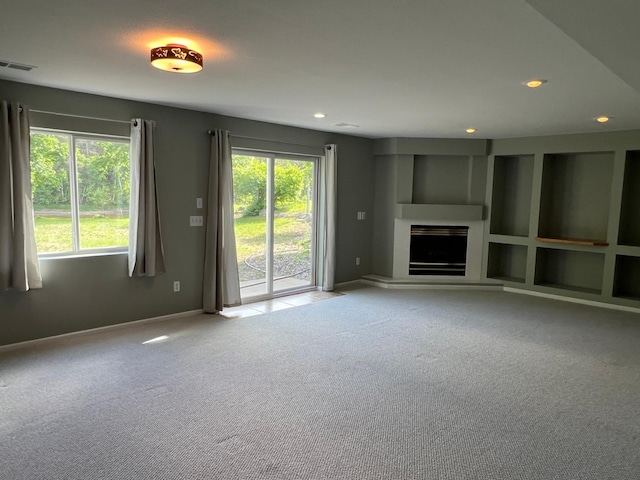 6563 Parkview Cir, Baxter, MN 56425 - unfurnished living room with carpet floors, recessed lighting, a fireplace, and baseboards