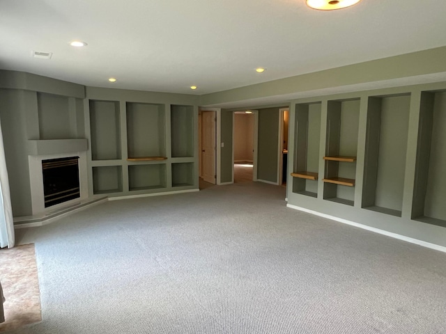 6563 Parkview Cir, Baxter, MN 56425 - unfurnished living room with carpet flooring, a fireplace with raised hearth, and recessed lighting