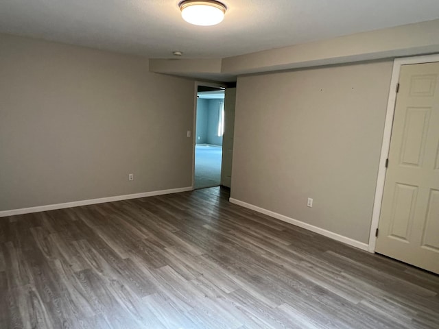 6563 Parkview Cir, Baxter, MN 56425 - unfurnished room with dark wood-style flooring and baseboards