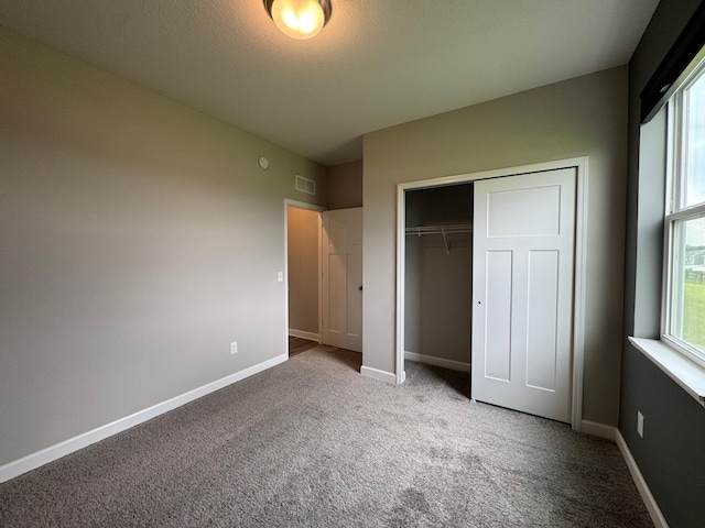 5022 Useppa Trl, Woodbury, MN 55129 - unfurnished bedroom with carpet flooring, a closet, and baseboards