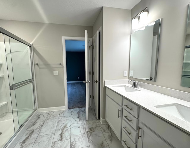 5022 Useppa Trl, Woodbury, MN 55129 - bathroom with marble look tiles, double vanity, a stall shower, and baseboards