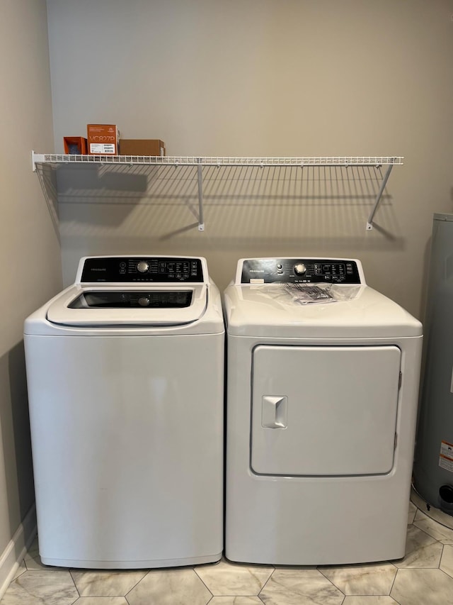 5022 Useppa Trl, Woodbury, MN 55129 - laundry area with water heater, light marble finish floors, and washer and dryer