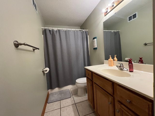823 4th St NE, Byron, MN 55920 - bathroom with vanity, toilet, a textured ceiling, tile patterned flooring, and a shower with curtain