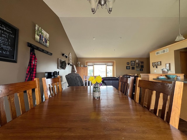 823 4th St NE, Byron, MN 55920 - dining space featuring lofted ceiling and a chandelier
