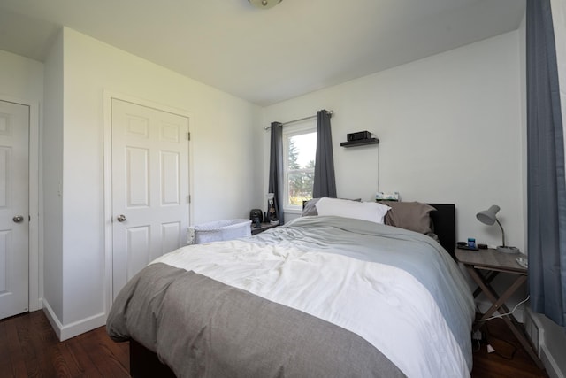 709 Cypress Ave S, Braham, MN 55006 - bedroom featuring wood finished floors and baseboards