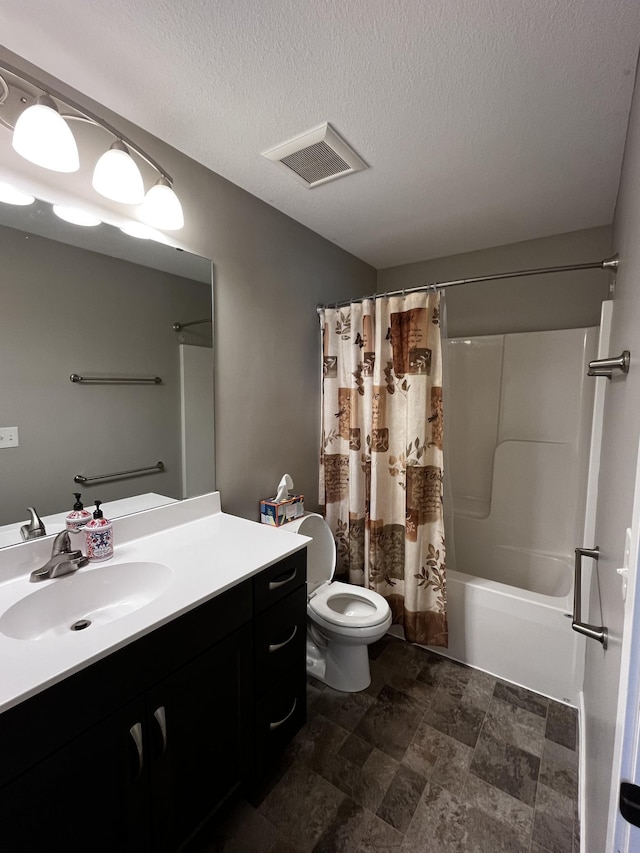4201 Silver Ridge Pl NW, Rochester, MN 55901 - bathroom with toilet, vanity, shower / bath combo, a textured ceiling, and stone finish floors