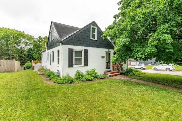327 Channing Ave, Fergus Falls, MN 56537 - view of front facade featuring stucco siding and roof with shingles