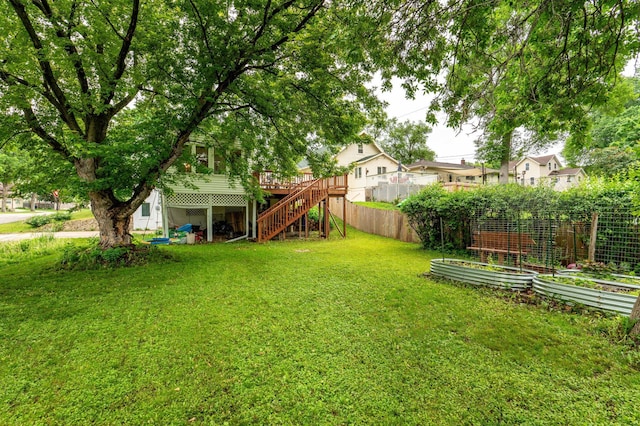 327 Channing Ave, Fergus Falls, MN 56537 - view of yard featuring a garden, stairs, and a deck