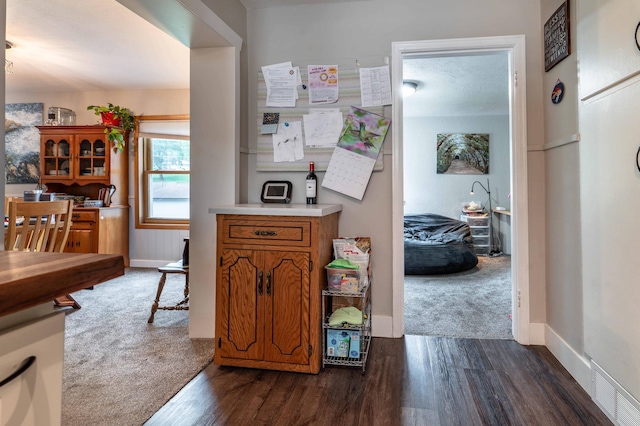 327 Channing Ave, Fergus Falls, MN 56537 - corridor with dark wood-type flooring and baseboards
