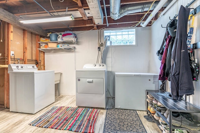 327 Channing Ave, Fergus Falls, MN 56537 - washroom with washing machine and dryer and wood finished floors