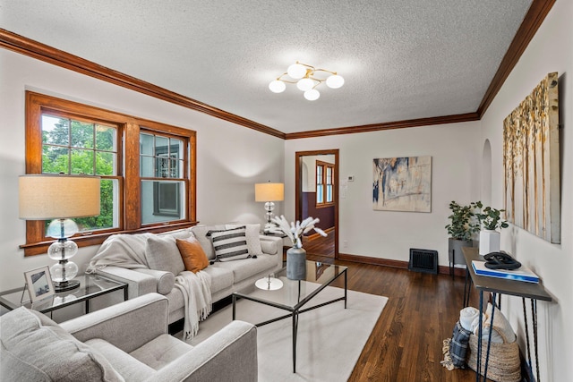 3017 32nd Ave NE, Saint Anthony, MN 55418 - living area with a textured ceiling, wood finished floors, ornamental molding, and arched walkways