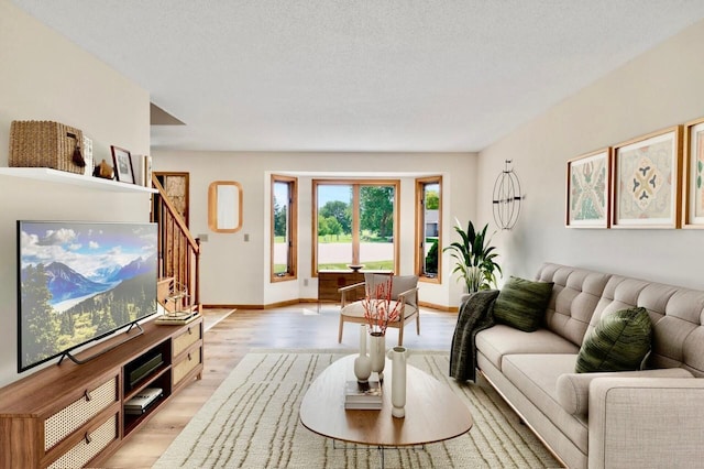 7158 Deerwood Ln N, Maple Grove, MN 55369 - living room with light wood-style flooring and stairs