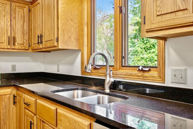 7158 Deerwood Ln N, Maple Grove, MN 55369 - kitchen with dark stone counters and brown cabinetry