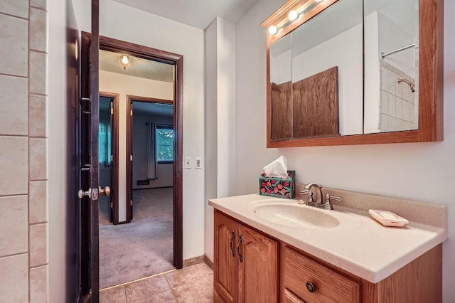10465 Osage St NW, Coon Rapids, MN 55433 - bathroom with vanity and tile patterned flooring