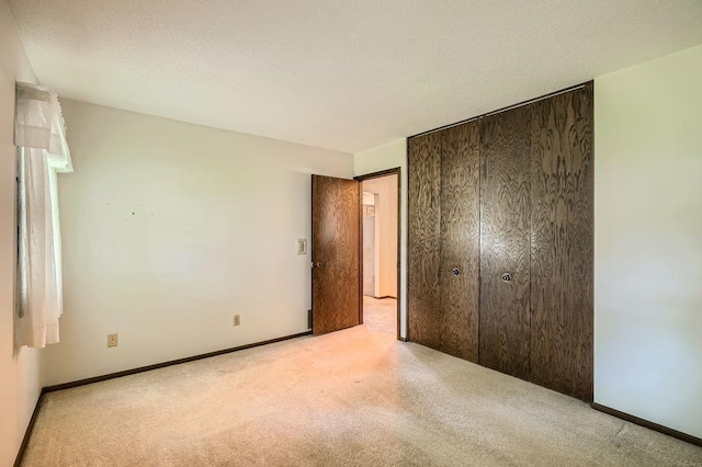10465 Osage St NW, Coon Rapids, MN 55433 - unfurnished bedroom with light carpet and a closet