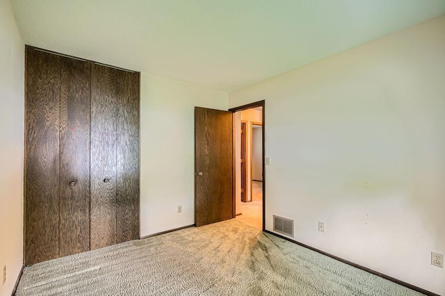 10465 Osage St NW, Coon Rapids, MN 55433 - unfurnished bedroom featuring carpet and a closet