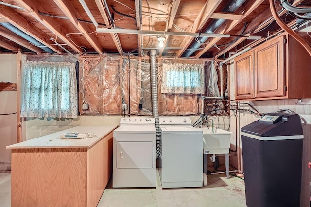 10465 Osage St NW, Coon Rapids, MN 55433 - laundry room featuring washing machine and dryer and cabinet space