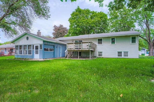 10465 Osage St NW, Coon Rapids, MN 55433 - back of property featuring a chimney, a wooden deck, stairs, a yard, and an attached garage