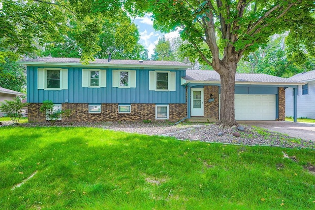 10465 Osage St NW, Coon Rapids, MN 55433 - split level home with board and batten siding, brick siding, an attached garage, and a front lawn