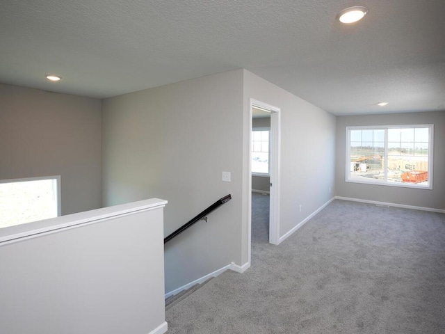 3235 Jandura Ave NE, Saint Michael, MN 55376 - corridor with an upstairs landing, healthy amount of natural light, carpet, recessed lighting, and a textured ceiling