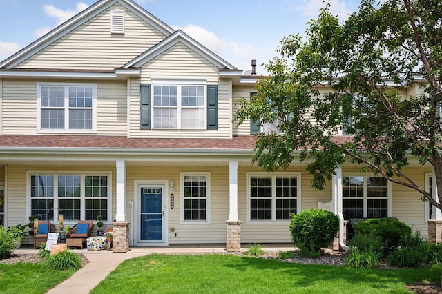 10612 172nd Ln NW, Elk River, MN 55330 - view of front of property featuring a porch, a front lawn, and a shingled roof