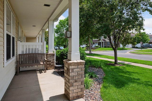 10612 172nd Ln NW, Elk River, MN 55330 - covered porch featuring a yard