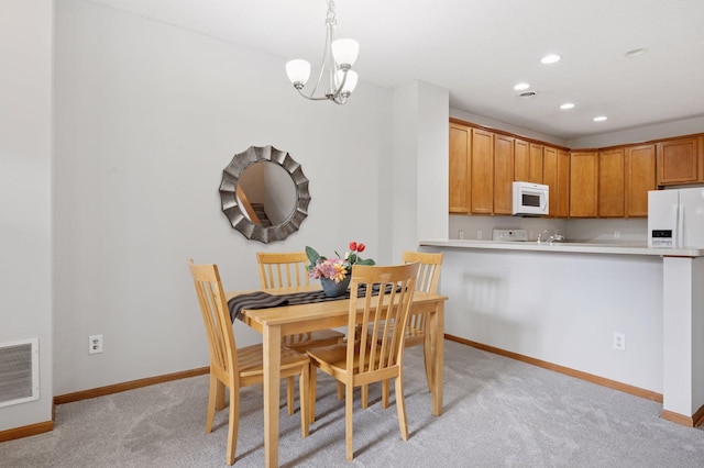 10612 172nd Ln NW, Elk River, MN 55330 - dining room featuring baseboards, light carpet, recessed lighting, and a chandelier