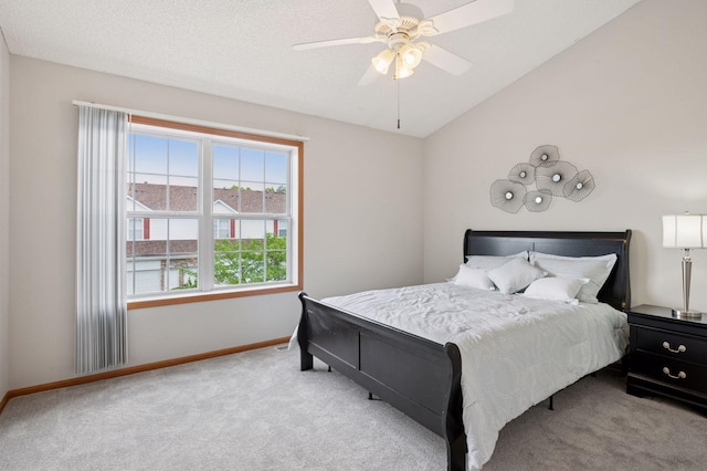 10612 172nd Ln NW, Elk River, MN 55330 - bedroom featuring carpet, vaulted ceiling, baseboards, and a ceiling fan