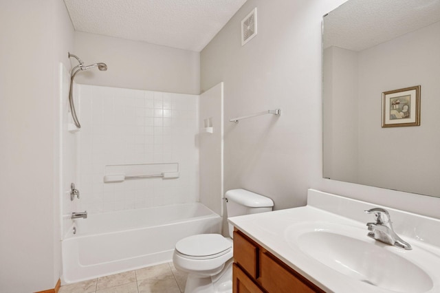 10612 172nd Ln NW, Elk River, MN 55330 - full bathroom with a textured ceiling, toilet, vanity, washtub / shower combination, and tile patterned flooring