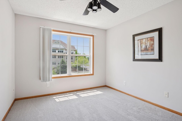 10612 172nd Ln NW, Elk River, MN 55330 - carpeted spare room with a textured ceiling, ceiling fan, and baseboards