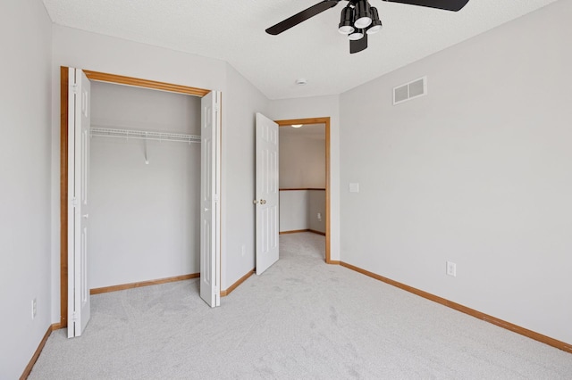 10612 172nd Ln NW, Elk River, MN 55330 - unfurnished bedroom with carpet, a closet, baseboards, and a ceiling fan