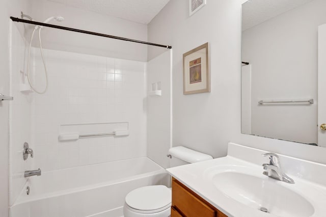 10612 172nd Ln NW, Elk River, MN 55330 - bathroom with a textured ceiling, vanity, toilet, and washtub / shower combination