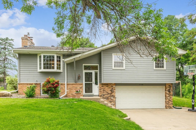 11788 65th Pl N, Maple Grove, MN 55369 - split foyer home with brick siding, a front yard, and a garage