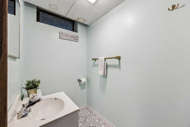 11788 65th Pl N, Maple Grove, MN 55369 - bathroom with a drop ceiling, baseboards, and vanity