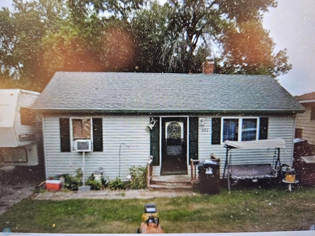 602 1st St, Hawley, MN 56549 - view of front of home with a chimney and entry steps