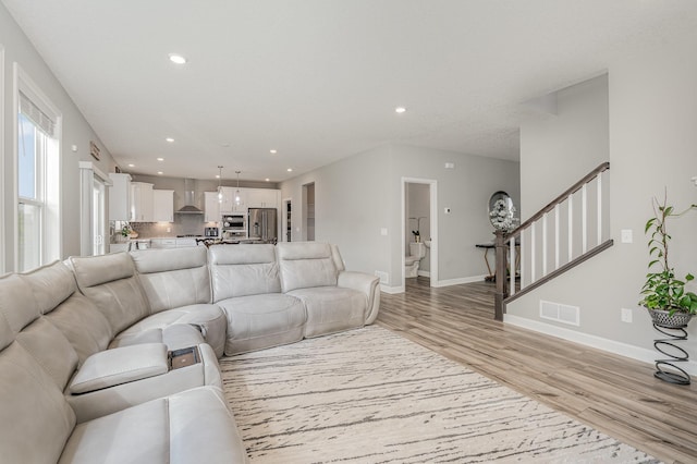 6016 Inskip Ave S, Cottage Grove, MN 55016 - living room with light wood-style flooring, stairway, recessed lighting, and baseboards