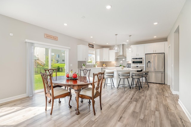 6016 Inskip Ave S, Cottage Grove, MN 55016 - dining area featuring recessed lighting, light wood-style flooring, and baseboards