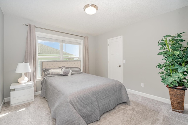 6016 Inskip Ave S, Cottage Grove, MN 55016 - bedroom with light carpet, baseboards, and a textured ceiling