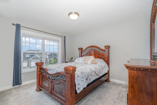 6016 Inskip Ave S, Cottage Grove, MN 55016 - bedroom with light carpet, a textured ceiling, and baseboards