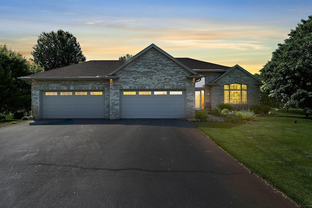 2554 160th Ave NE, Ham Lake, MN 55304 - view of front of property featuring driveway, a garage, and a front lawn