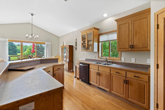 2554 160th Ave NE, Ham Lake, MN 55304 - kitchen with dishwasher, a sink, light wood-style flooring, vaulted ceiling, and brown cabinets