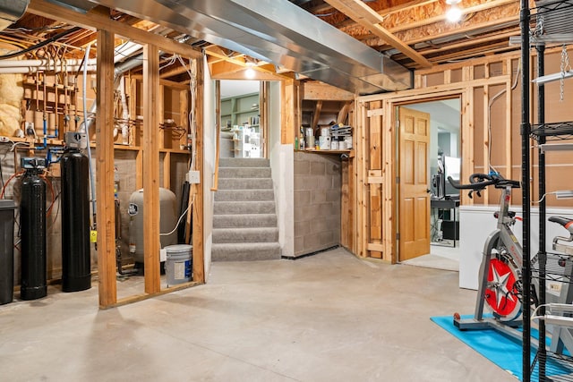 2554 160th Ave NE, Ham Lake, MN 55304 - unfinished basement with a water pressure tank, a water softener, and stairs