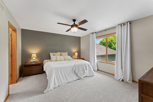 2554 160th Ave NE, Ham Lake, MN 55304 - bedroom featuring light colored carpet, baseboards, and ceiling fan