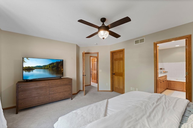 2554 160th Ave NE, Ham Lake, MN 55304 - bedroom featuring light colored carpet, baseboards, ensuite bathroom, and ceiling fan