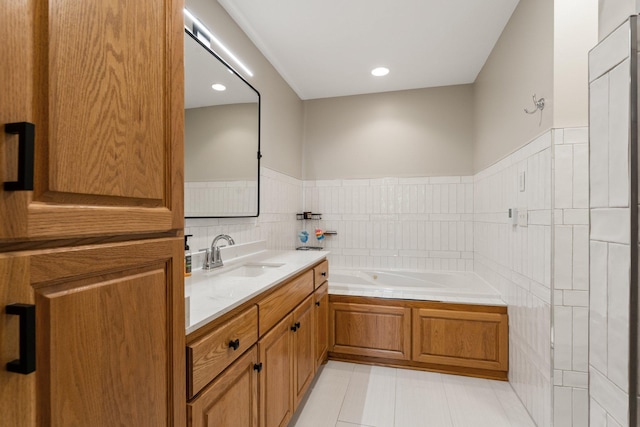 2554 160th Ave NE, Ham Lake, MN 55304 - full bathroom with a bath, vanity, and a wainscoted wall